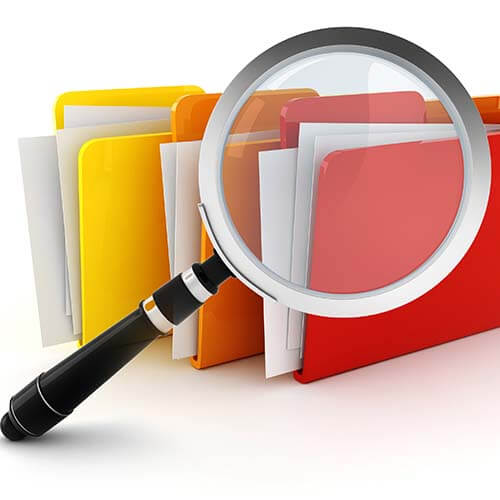 Magnifying glass and colored file folders