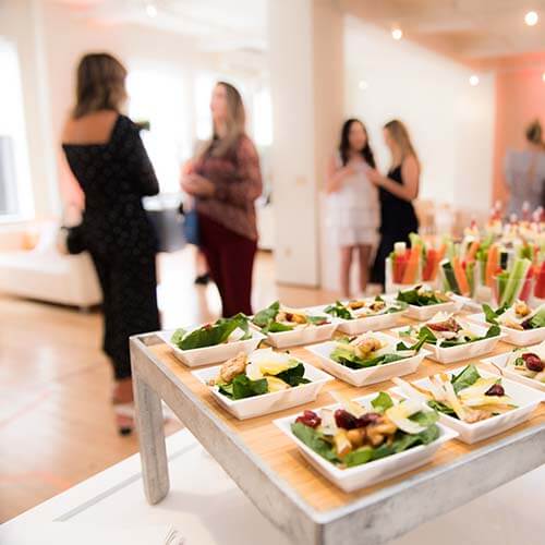 Company party with buffet and people talking