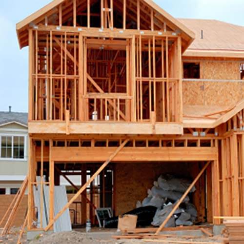 House under construction symbolizing construction contracts completed percentage