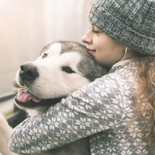 Young girl with pet dog