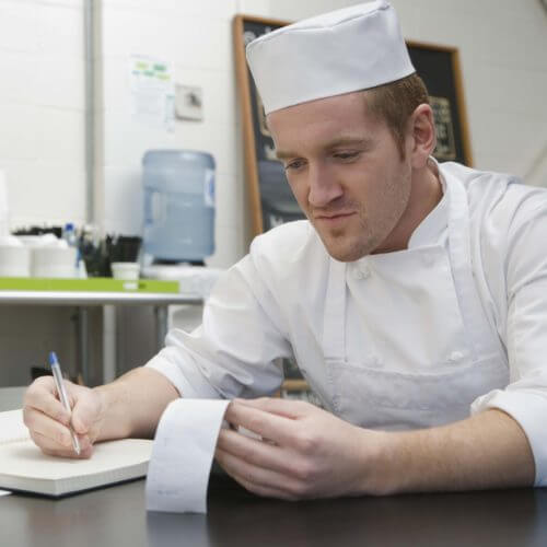 chef studying accounting receipt