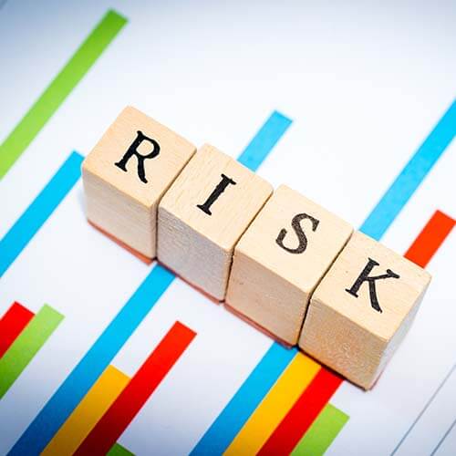 RISK spelled on blocks symbolizing business fraud risk