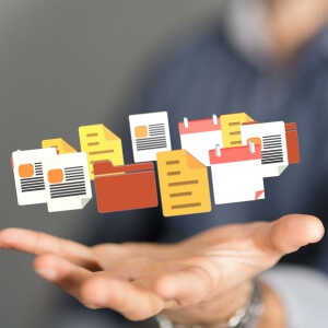 Hand with file images of business records