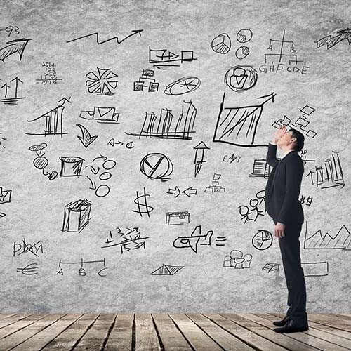 man looking confused at process on wall