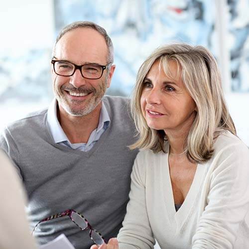 senior couple meeting financial advisor