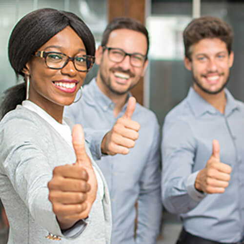Successful business people showing thumbs up.