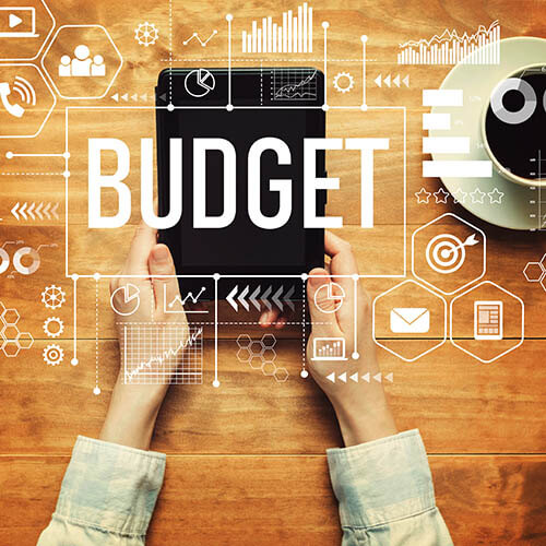 Budget with a person holding a tablet computer