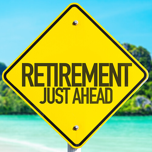 Retirement Just Ahead sign with beach background