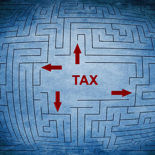 Red tax word and arrows in maze