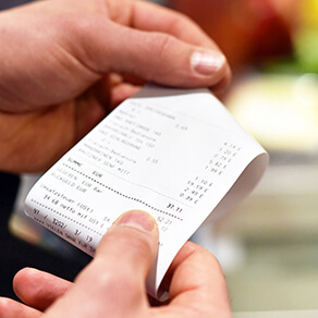 woman holding store receipt