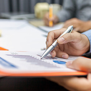man with pen and paper