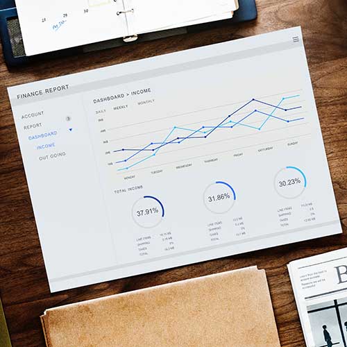 finance report with computer in background