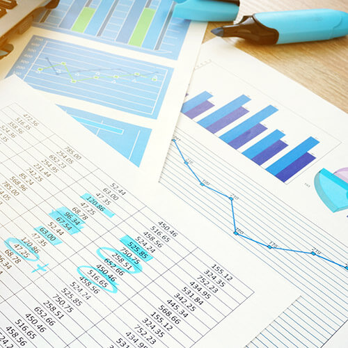 documents highlighted in blue with highlighter and charts
