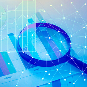 Magnifying glass hovering over charts