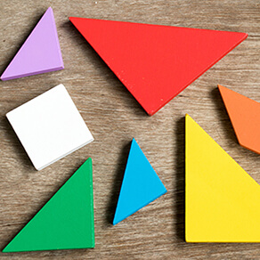 Triangular pieces on wood background