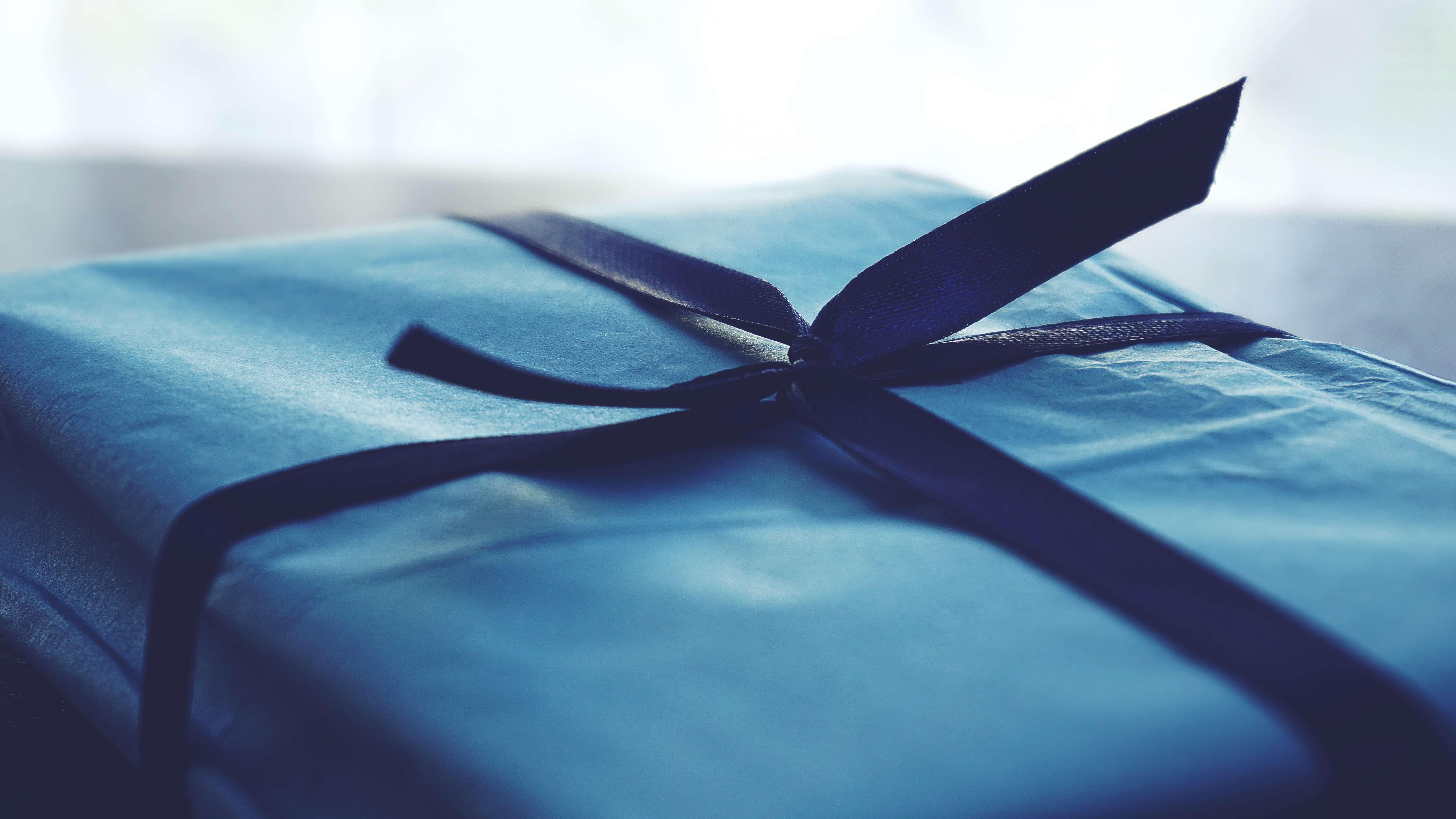 blue box wrapped with ribbon