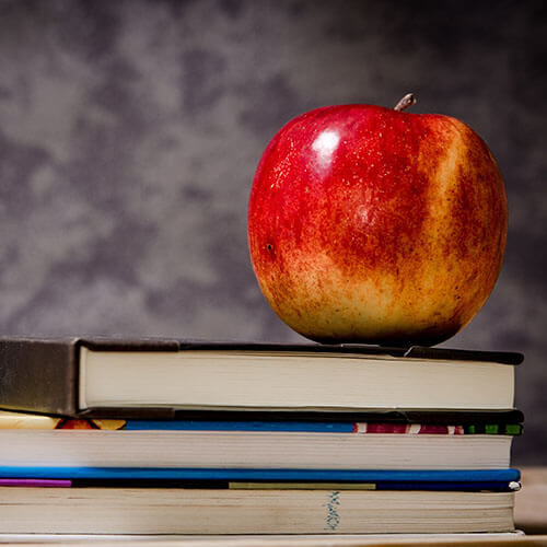 apple on stack of books