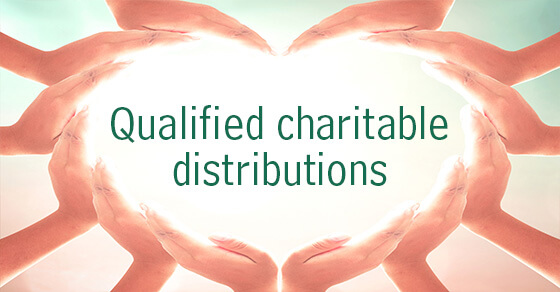 hands holding words qualified charitable distributions
